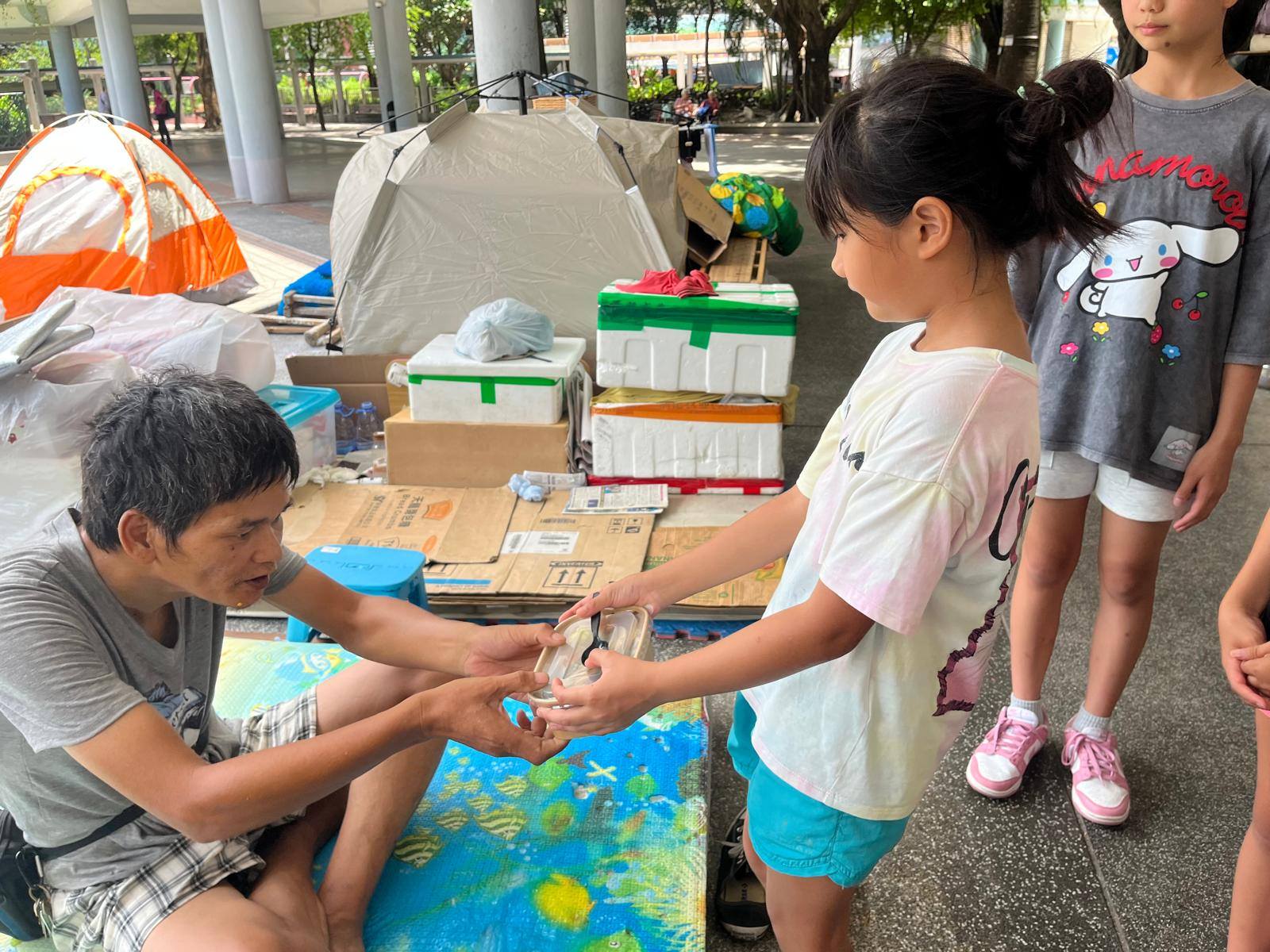 Washing vegetables outdoors